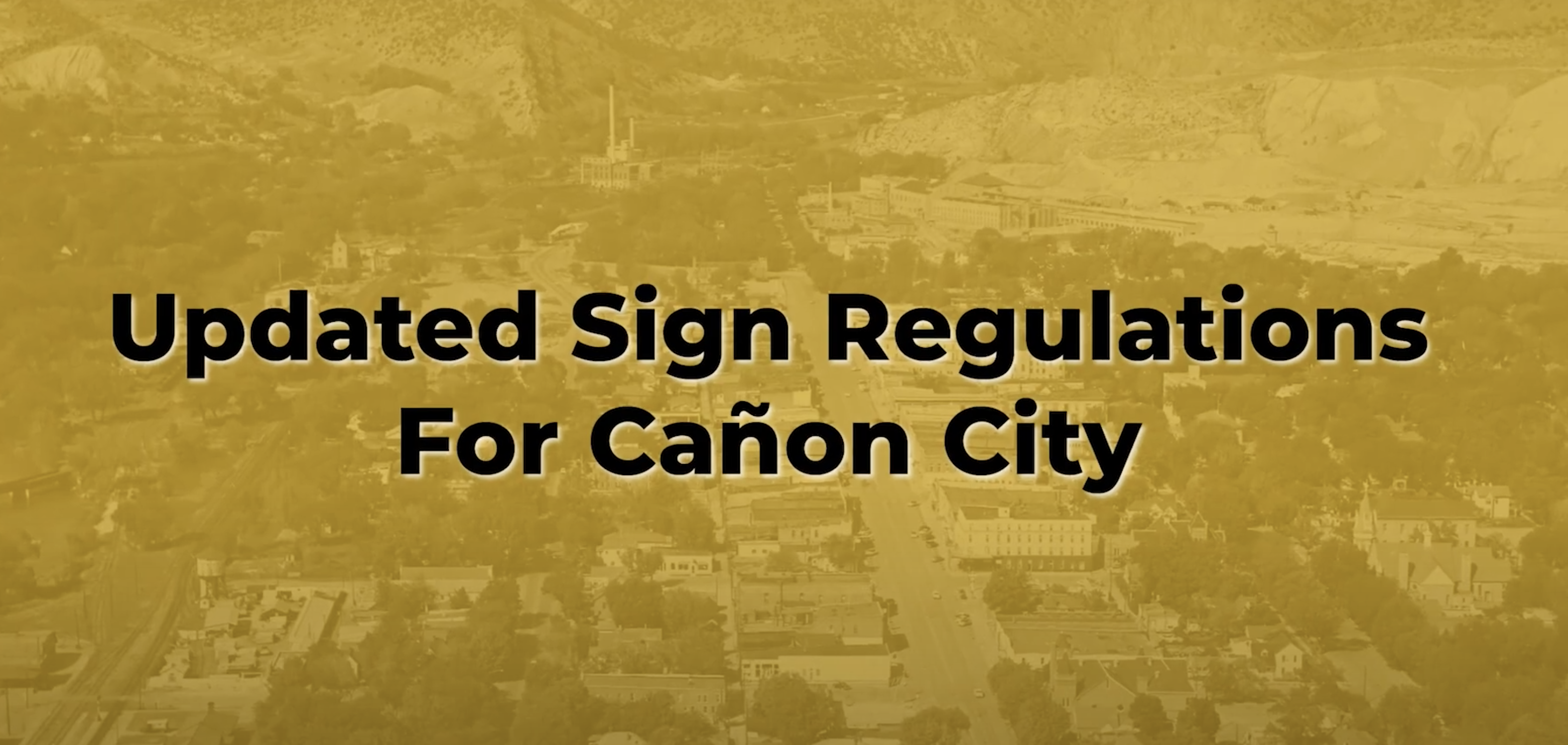 Black and White Image of City streets overview with words 